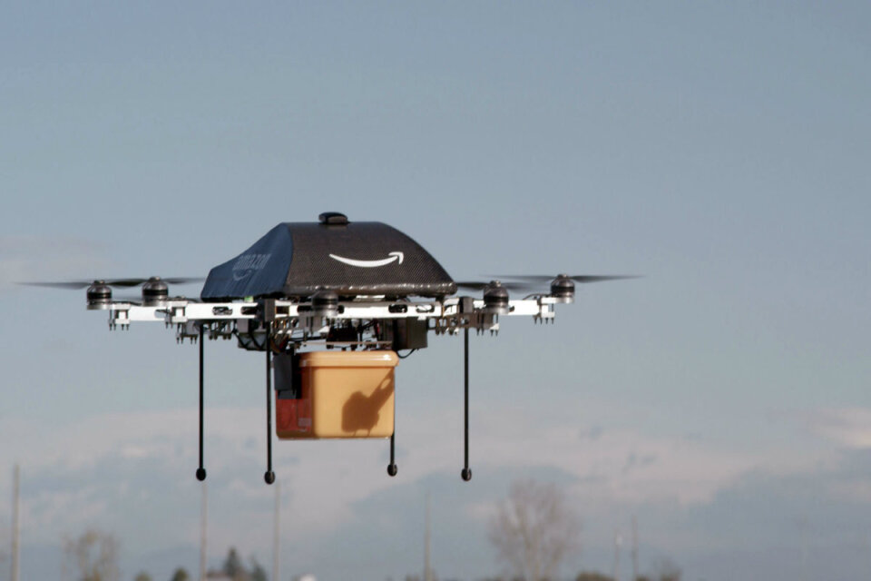 Amazon drone bot flying with package